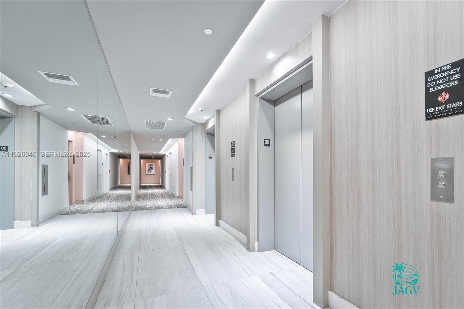 4010 South Ocean Drive, Unit R3005 Hollywood, FL 33019 - Photo 13 of 57 a view of a hallway with wooden floor