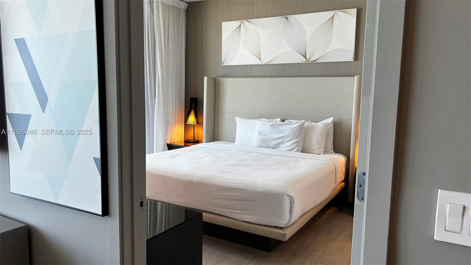 4010 South Ocean Drive, Unit R3005 Hollywood, FL 33019 - Photo 2 of 57 a bedroom with a bed and a window