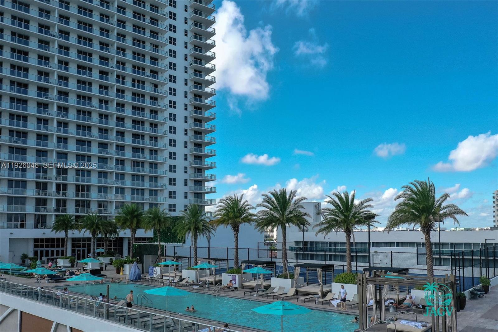 4010 South Ocean Drive, Unit R3005 Hollywood, FL 33019 - Photo 21 of 57 a front view of a building with palm trees