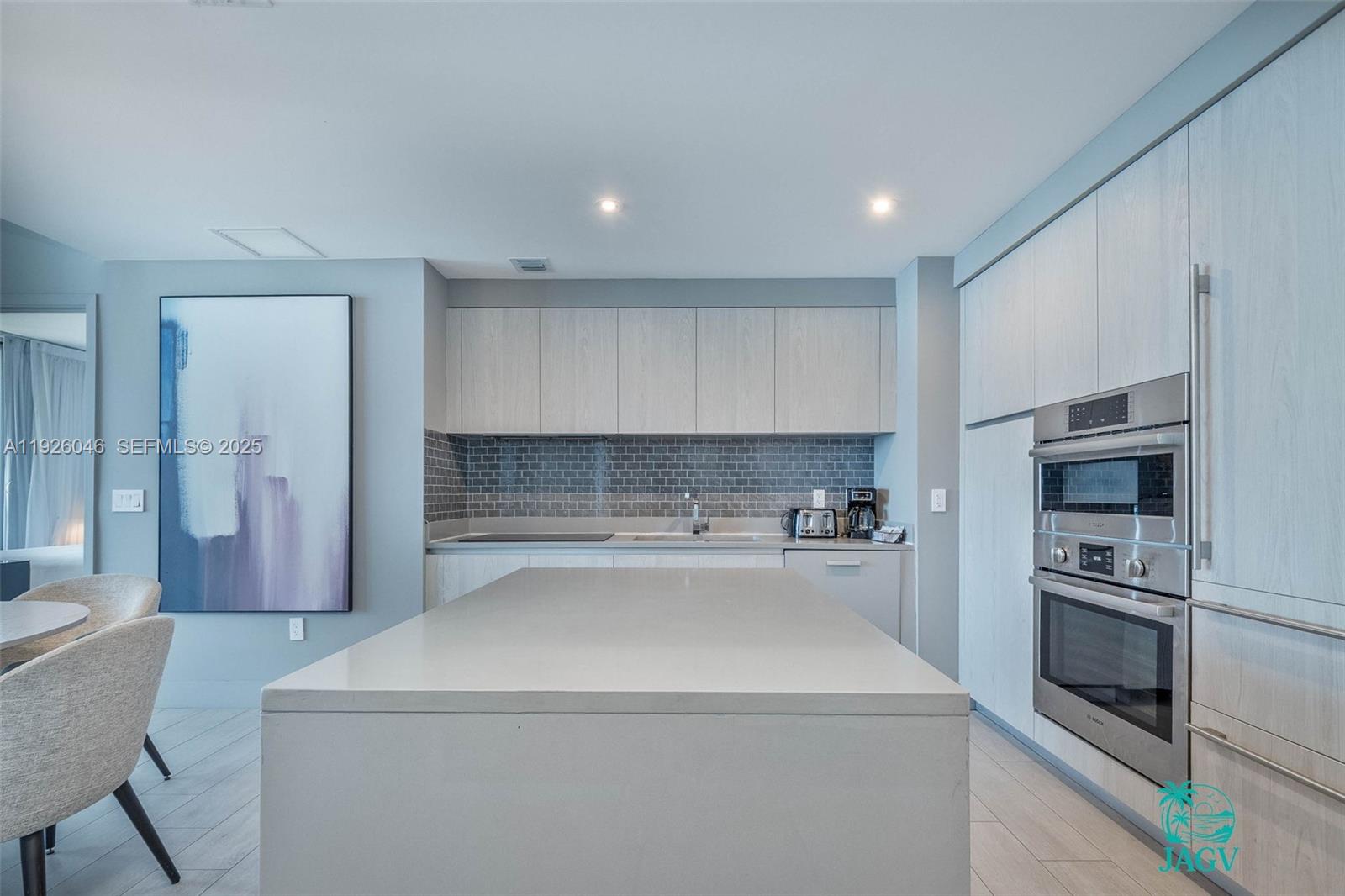 4010 South Ocean Drive, Unit R3005 Hollywood, FL 33019 - Photo 46 of 57 a kitchen with a stove and a refrigerator