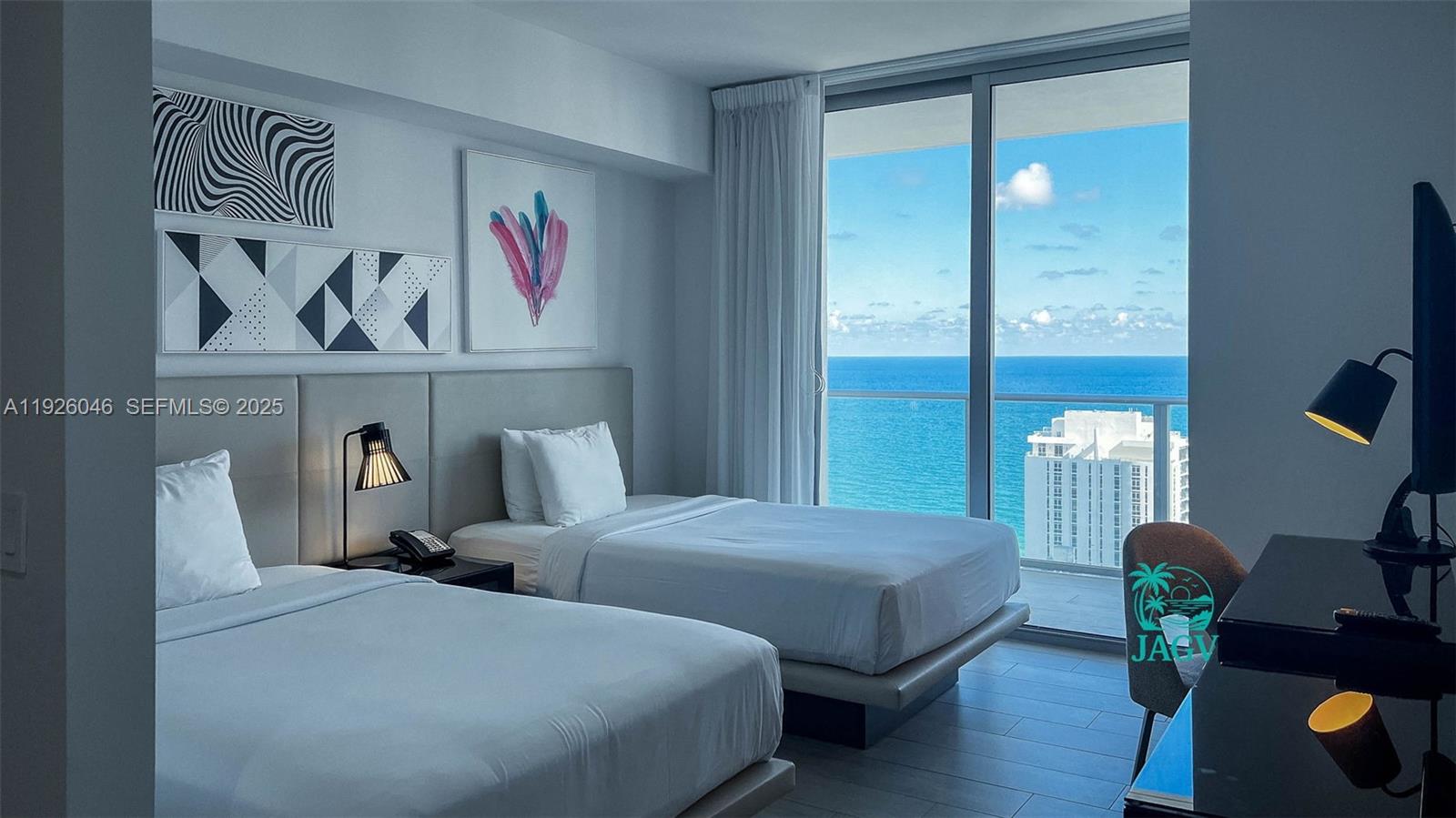 4010 South Ocean Drive, Unit R3005 Hollywood, FL 33019 - Photo 48 of 57 a bedroom with bed and a painting on the wall