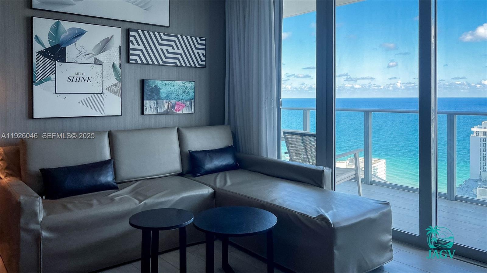 4010 South Ocean Drive, Unit R3005 Hollywood, FL 33019 - Photo 49 of 57 a living room with furniture and a gate