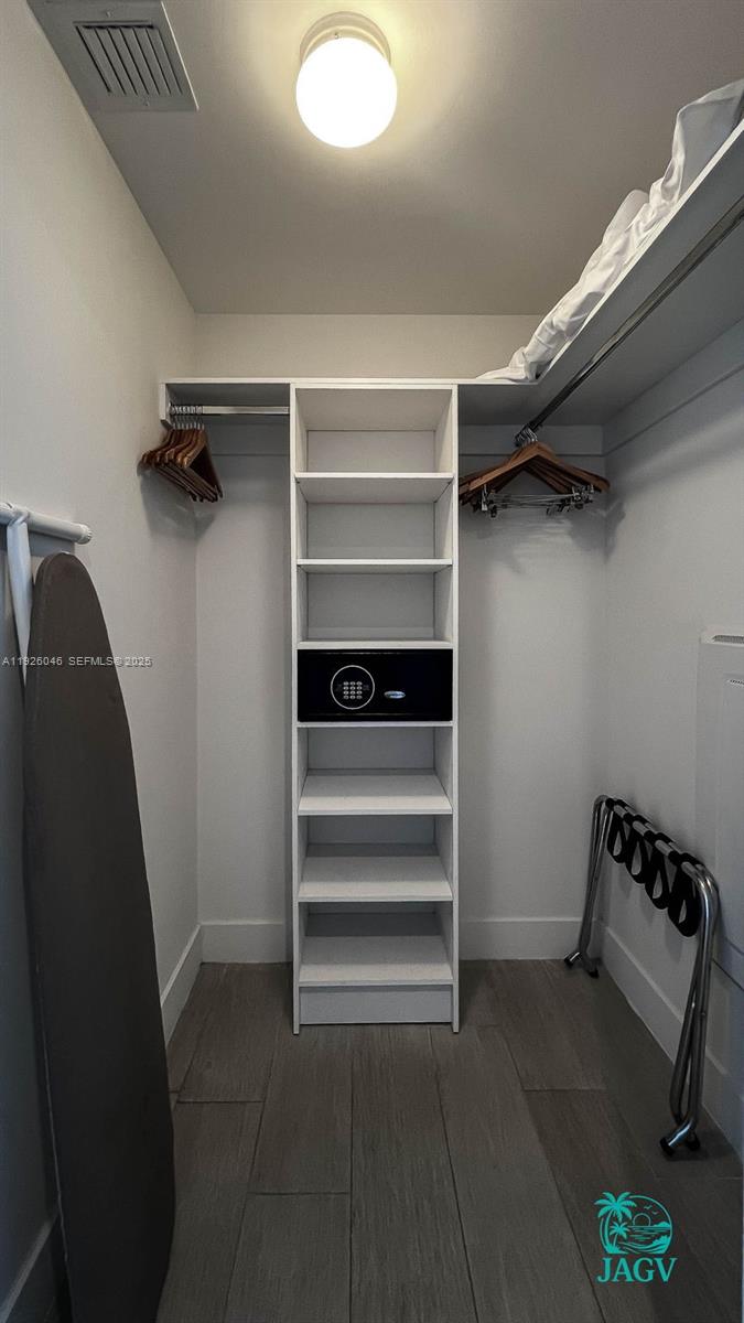 4010 South Ocean Drive, Unit R3005 Hollywood, FL 33019 - Photo 52 of 57 a view of walk in closet with empty racks