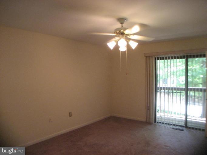 1984 Winterport Cluster Reston, VA 20191 - Photo 3 of 21 Ceiling fan in master bedroom