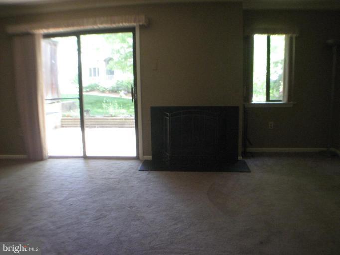 1984 Winterport Cluster Reston, VA 20191 - Photo 8 of 21 Family room with fireplace
