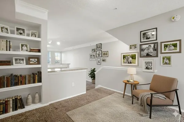 a room with furniture and a book shelf