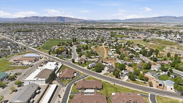 1838 West 300th Street South, Unit B Mapleton, UT 84664 - Photo 46 of 51 Expansive aerial perspective showcasing a residential development with established homes, tree-lined streets, and open green spaces