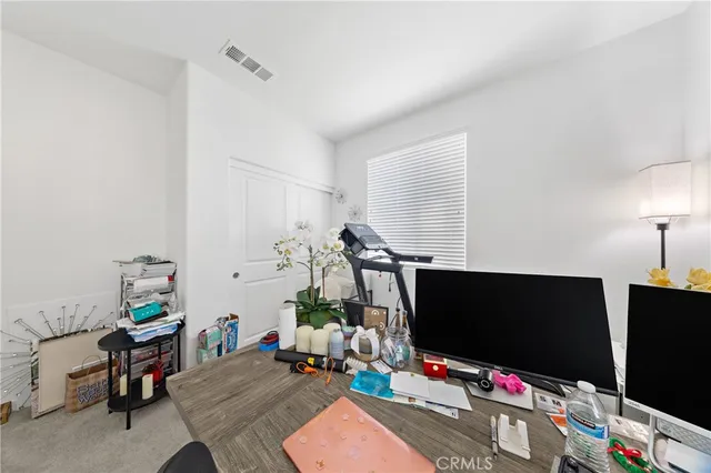 a room with furniture and a flat screen tv