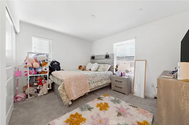 a bed room with a bed and a window