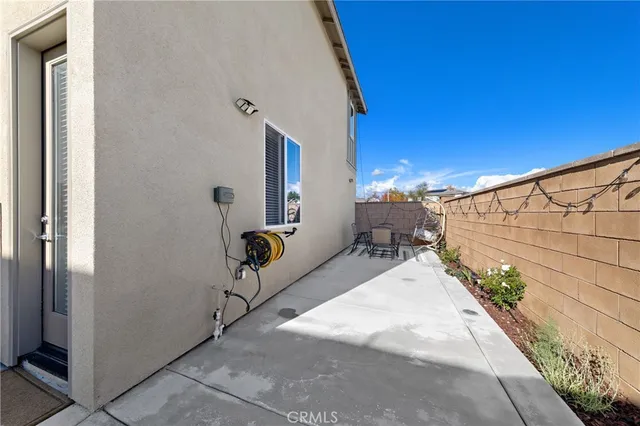 a balcony with chairs and table