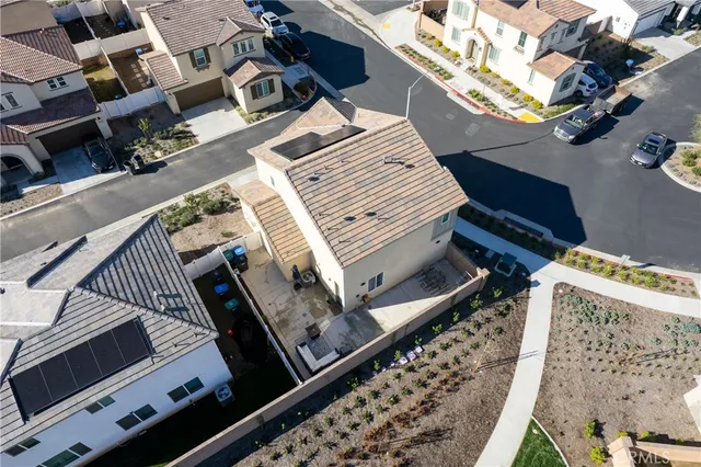 a view of a balcony with two chairs and a stove