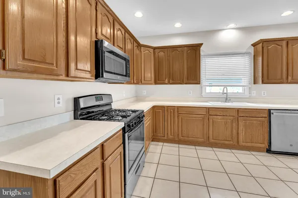 a view of empty room with a fireplace