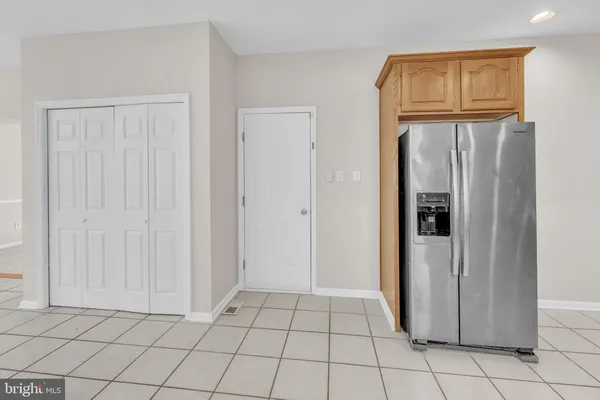 a view of empty room with a fireplace