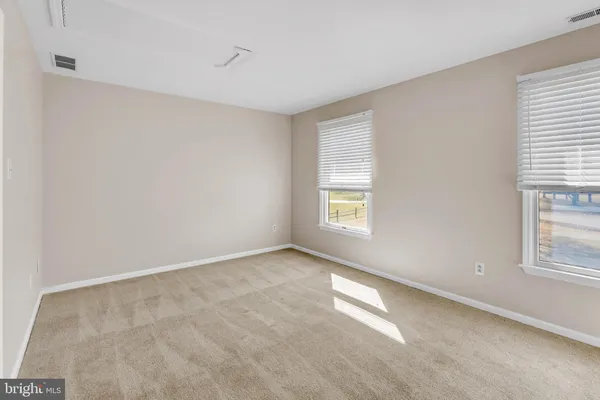 a view of a room with wooden floor and closet
