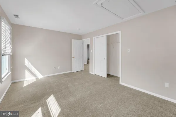 an empty room with mirror