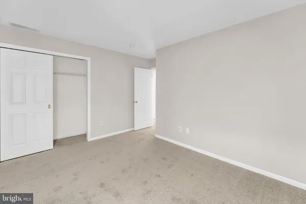 a front view of house with yard and trees