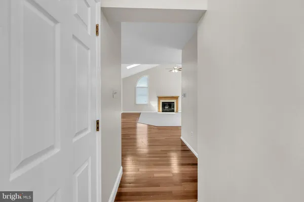a bathroom with a granite countertop toilet a sink and a mirror