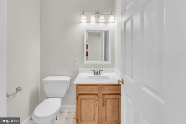 a kitchen with a sink a counter top space and stainless steel appliances