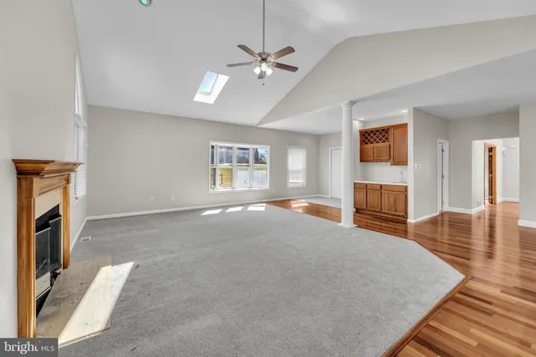 a kitchen with a sink a stove cabinets and stainless steel appliances