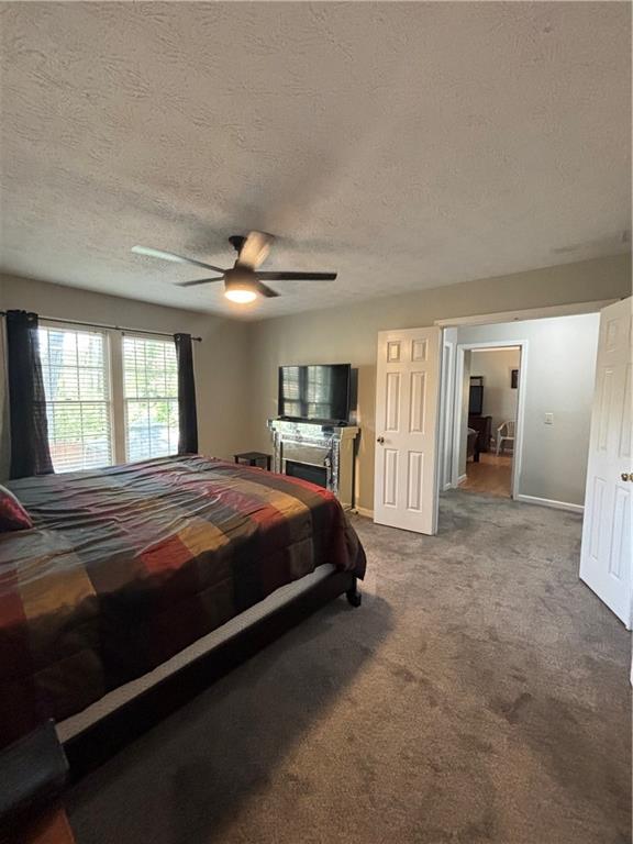 4949 Penscot Way Stone Mountain, GA 30088 - Photo 26 of 40 a spacious bedroom with a bed and a large window