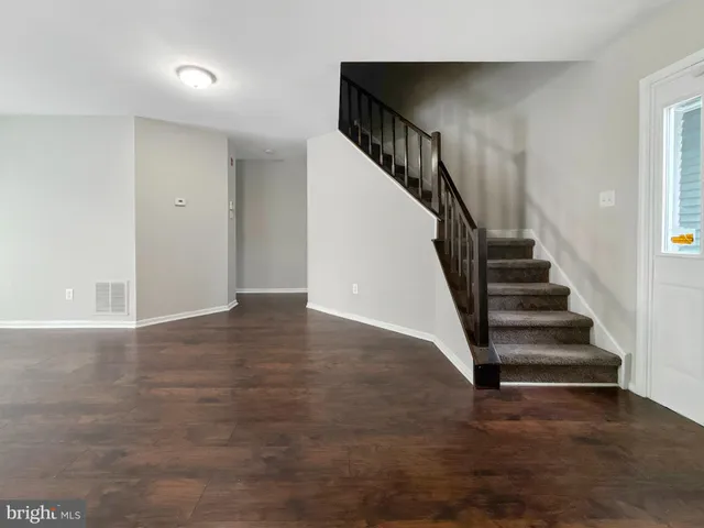 a view of entryway with wooden floor