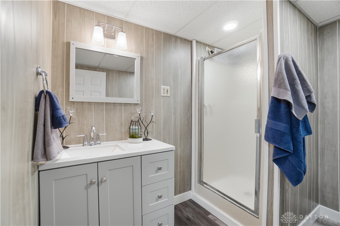 7553 Coffin Station Road Springfield, OH 45502 - Photo 76 of 95 This modern bathroom features a stylish vanity and a sleek shower, offering both comfort and functionality.