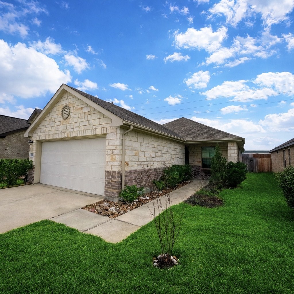 5515 Savanna Pasture Road Katy, TX 77493 - Photo 1 of 17 a front view of a house with a yard and garage
