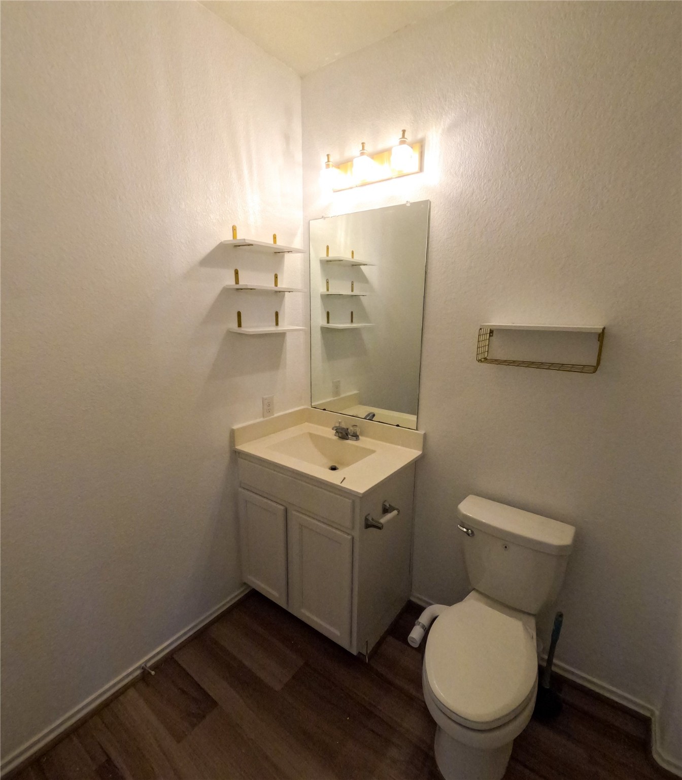 5515 Savanna Pasture Road Katy, TX 77493 - Photo 12 of 17 a bathroom with a toilet sink and mirror