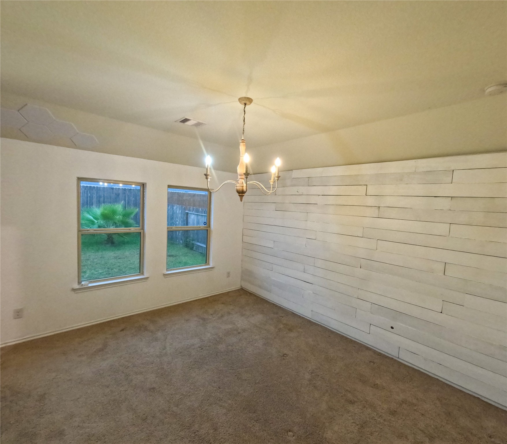 5515 Savanna Pasture Road Katy, TX 77493 - Photo 8 of 17 wooden floor in an empty room with a window