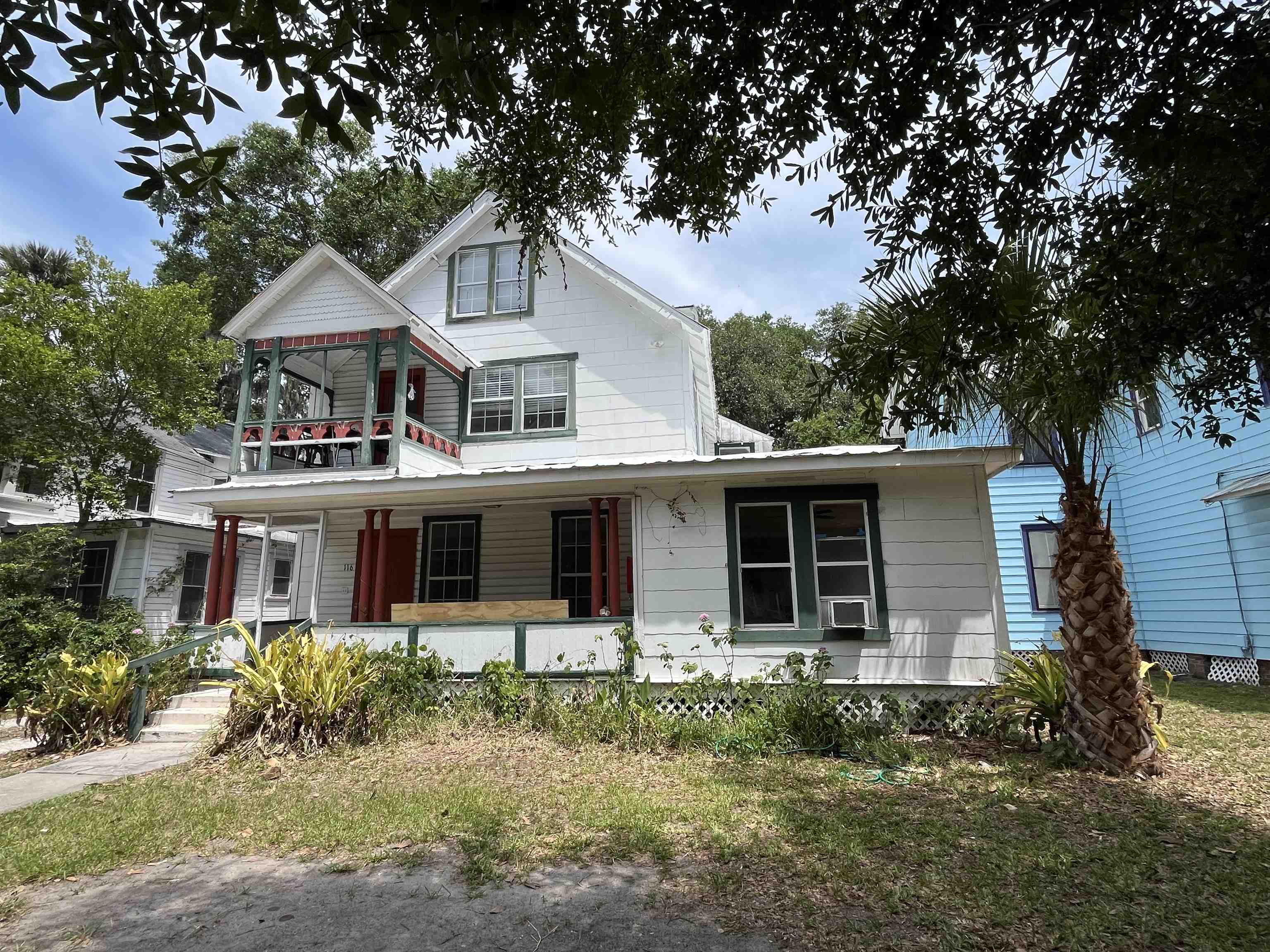 a house that has tree in front of it