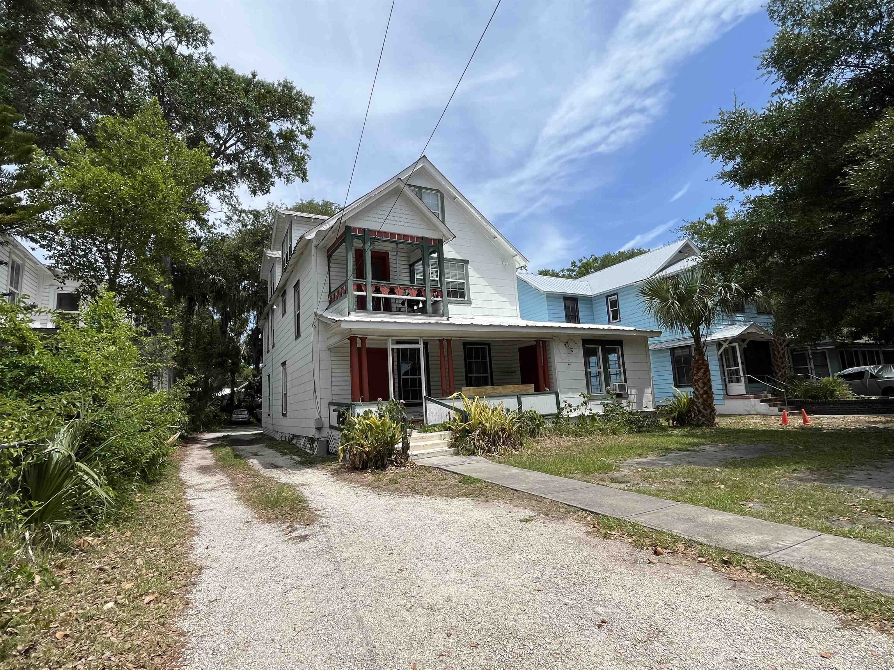 116 Bridge Street, Unit 1 St. Augustine, FL 32084 - Photo 2 of 8 a front view of a house with a yard