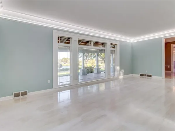 an empty room with windows and closet