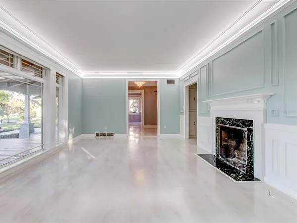 an empty room with windows and closet