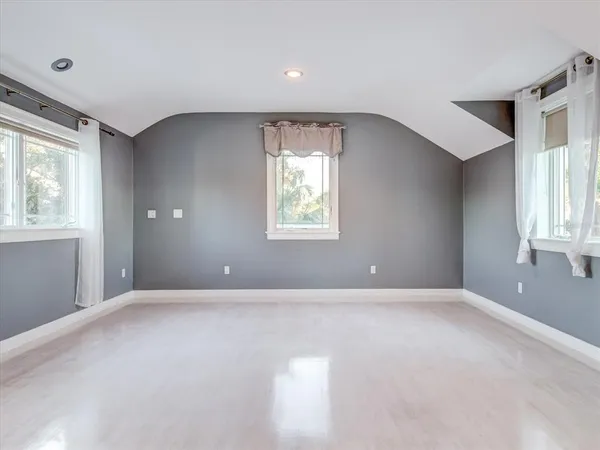 a bedroom with bed and window