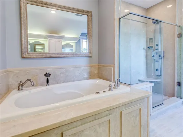 a view of swimming pool with outdoor seating and plants