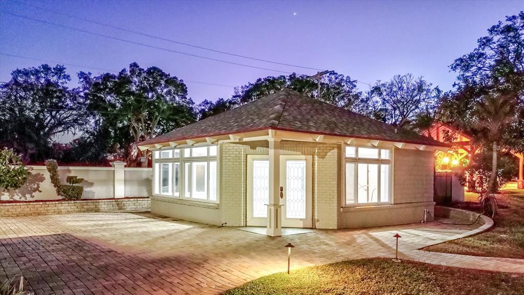 518 Riverside Drive Tarpon Springs, FL 34689 - Photo 63 of 82 a front view of a house with a garage