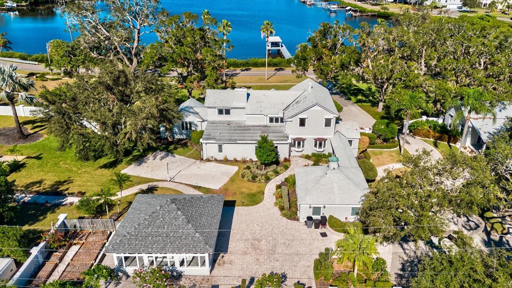 518 Riverside Drive Tarpon Springs, FL 34689 - Photo 76 of 82 an aerial view of a house with a yard swimming pool and outdoor seating