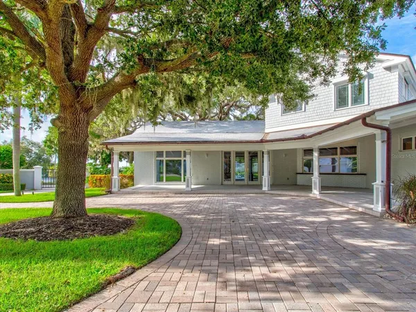 a front view of house with yard outdoor seating and barbeque oven