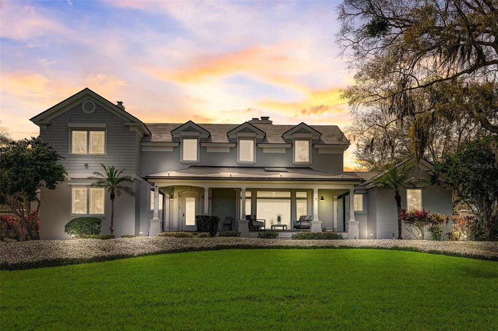518 Riverside Drive Tarpon Springs, FL 34689 - Photo 10 of 82 a front view of house with yard outdoor seating and barbeque oven