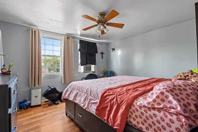 a bedroom with a bed and window