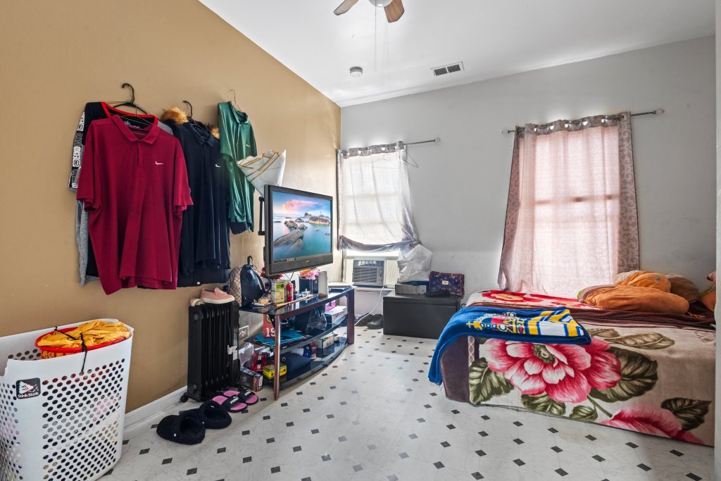 2730 South 58th Court Cicero, IL 60804 - Photo 25 of 35 a bedroom with furniture and a window