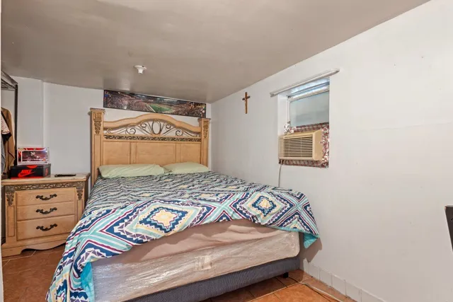 a bedroom with a bed and a closet