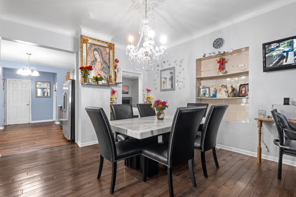 2730 South 58th Court Cicero, IL 60804 - Photo 6 of 35 a view of a dining room with furniture and wooden floor