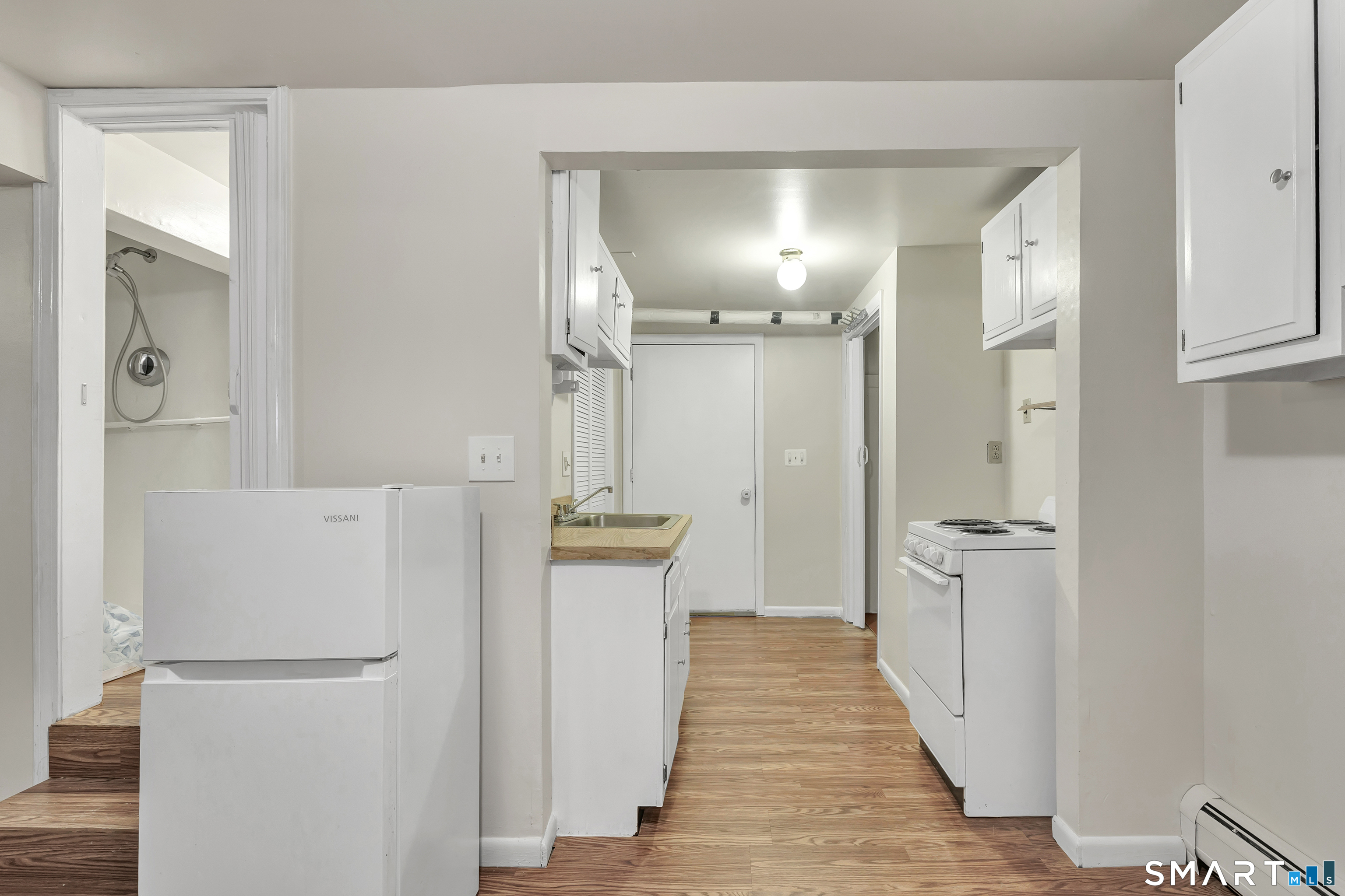 123 River Road Shelton, CT 06484 - Photo 21 of 27 a view of a hallway with wooden floor
