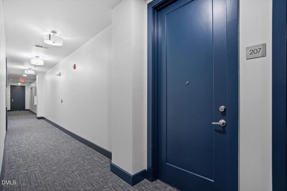 1300 St Marys Street, Unit 207 Raleigh, NC 27605 - Photo 23 of 31 a view of a hallway