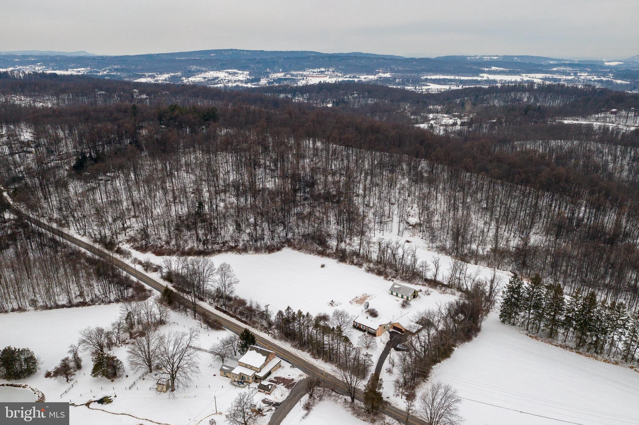 203 Alleghenyville Road Mohnton, PA 19540 - Photo 32 of 37 Serene winter landscape with rolling hills.