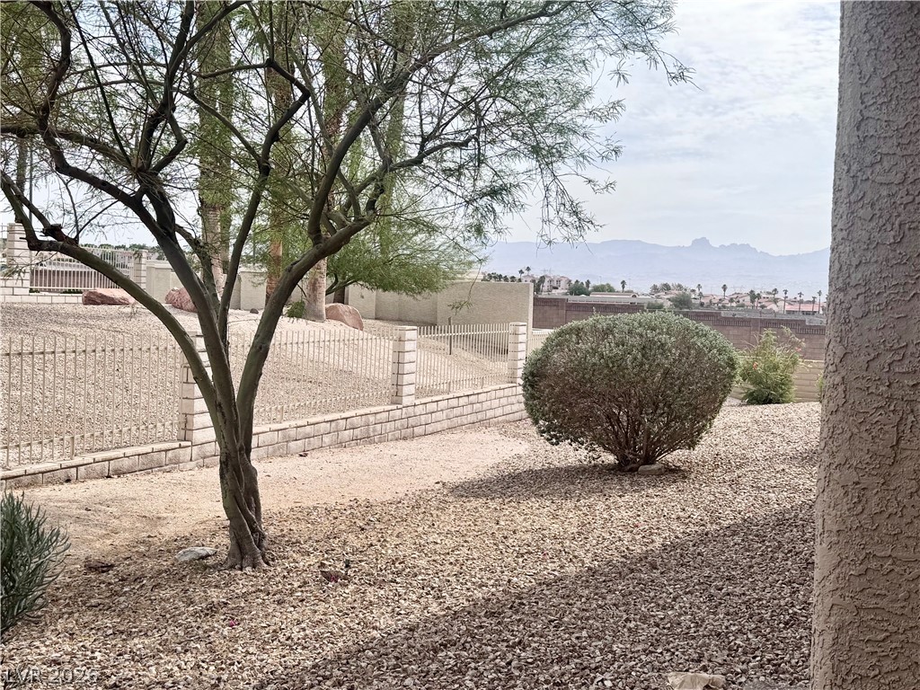 2160 Highpointe Drive, Unit 102 Laughlin, NV 89029 - Photo 21 of 28 Fenced backyard with a mountain view