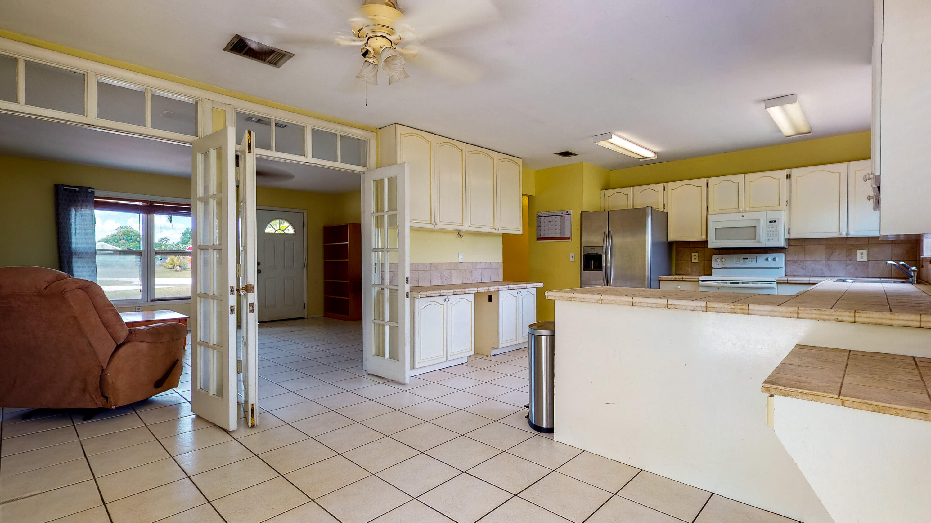 391 Southwest Homeland Road Port St. Lucie, FL 34953 - Photo 7 of 46 Kitchen/dining to living