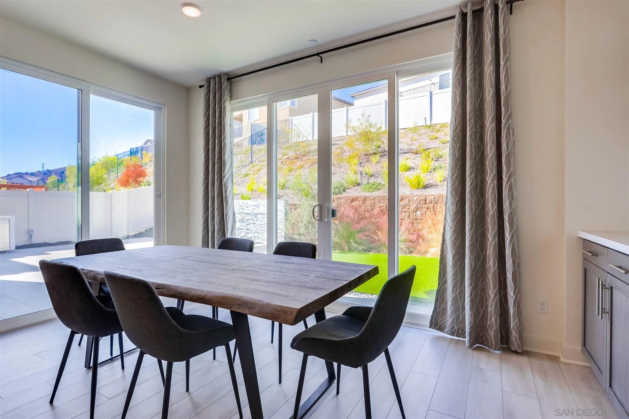 8922 Trailridge Avenue Santee, CA 92071 - Photo 11 of 31 a dining room with furniture and wooden floor