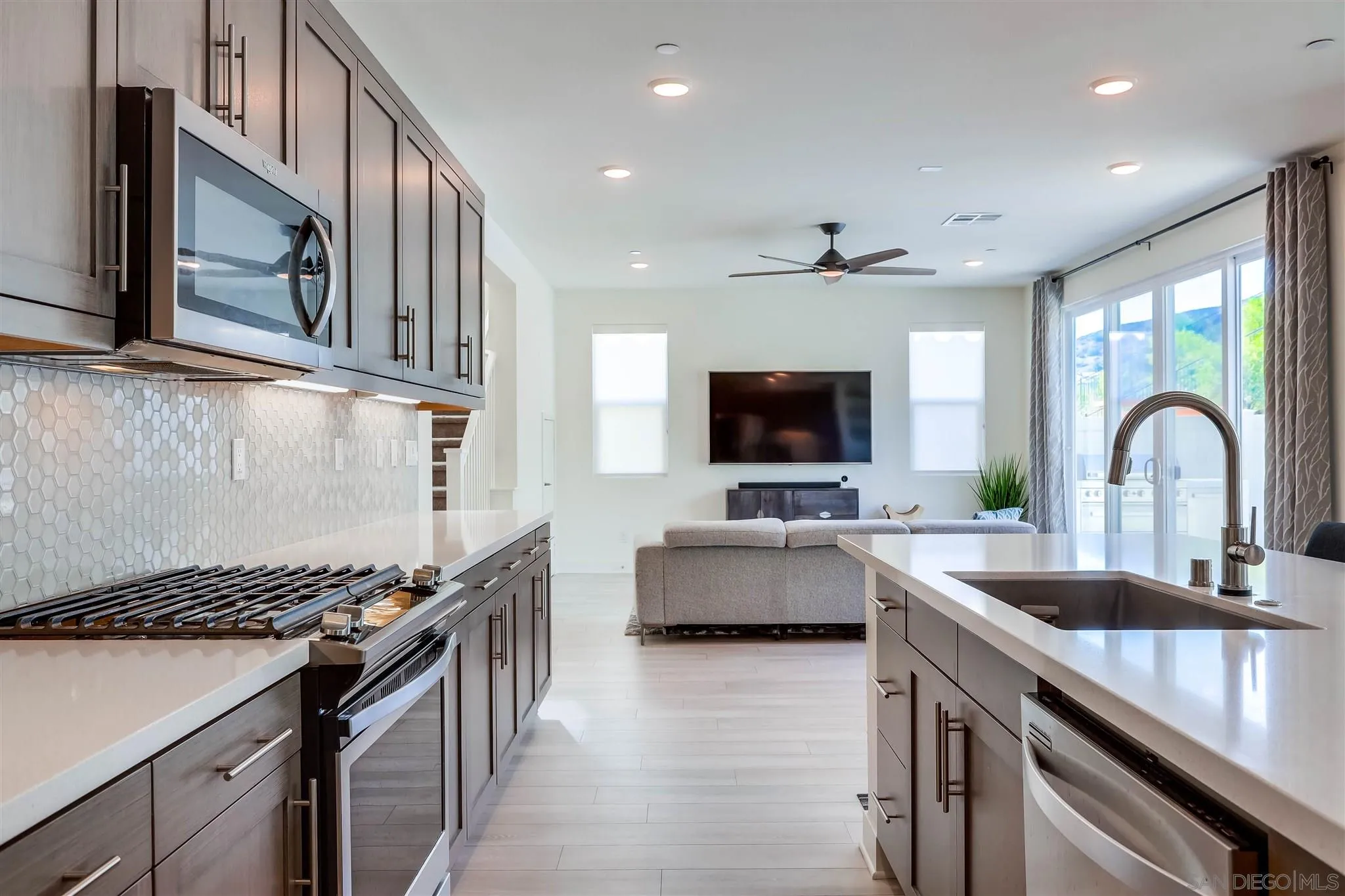 8922 Trailridge Avenue Santee, CA 92071 - Photo 12 of 31 a kitchen with stainless steel appliances granite countertop a stove and a sink